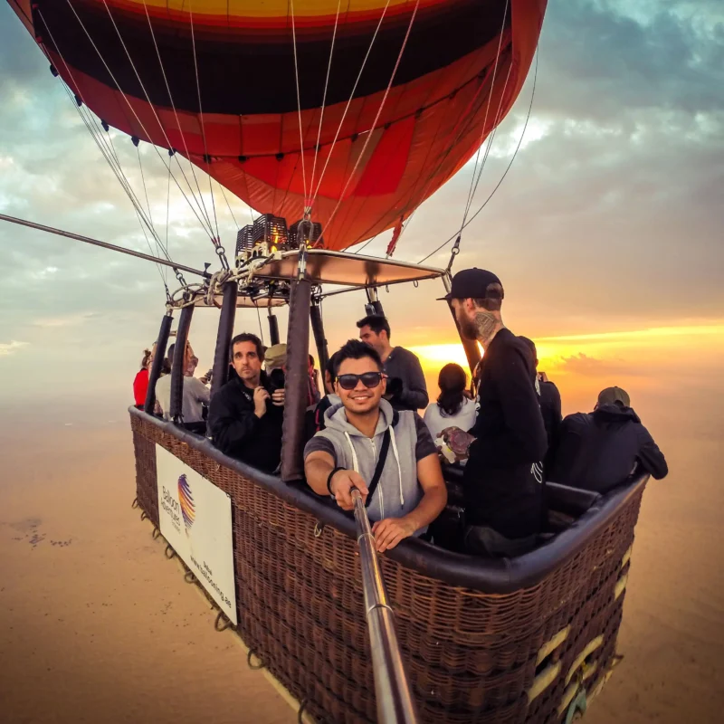 Hot Air Balloon with people riding in the basket